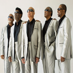 Gospel Music group Blind Boys of Alabama wearing suits and facing on one side