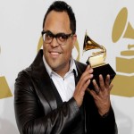 Israel Houghton holding a Grammy award