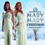 Mary Mary wearing white gown in a snowy background - My Christian Musician