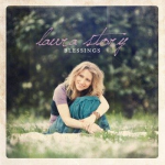 Christian musician Laura Story sitting on the grass - My Christian Musician