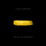 Stroke of yellow paint on a black canvas as a cover art for the song Deep Down (Walk Through Fire) with a text above that says "LINCOLN BREWSTER" and "GOD OF THE IMPOSSIBLE" below - My Christian Musician