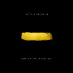Stroke of yellow paint on a black canvas as an album cover art with a text above that says "LINCOLN BREWSTER" and "GOD OF THE IMPOSSIBLE" below - My Christian Musician