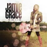 Jamie Grace standing, holding a guitar while looking away, and a text on the right that says "JAMIE GRACE, ONE SONG AT A TIME" - My Christian Musician