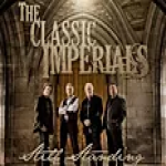 The Imperials standing in front of a big wooden door - My Christian Musician