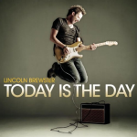 Lincoln Brewster midair with his electric guitar, with a text that displays "LINCOLN BREWSTER TODAY IS THE DAY" - My Christian Musician