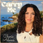 Portrait of Cheri Adams with a cliff and sea as the background as a cover art for her song "Carry Me" - My Christian Musician