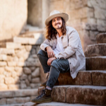 Jordan Feliz sitting on a stone stairs - My Christian Musician
