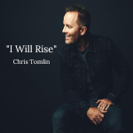 Chris Tomlin wearing a black jacket and denim jeans sitting while facing sideways, as a cover art for his song "I Will Rise" - My Christian Musician