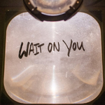 Wait On You text written on a projector glass - My Christian Musician